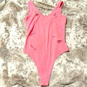Pink ripped body suit